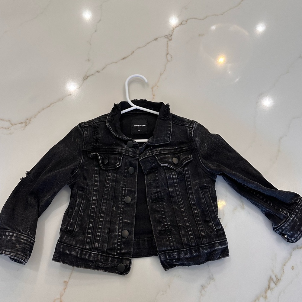 Toddler distressed black denim jacket, size 2T.